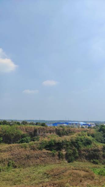 istock Factory near by hill 1413400278