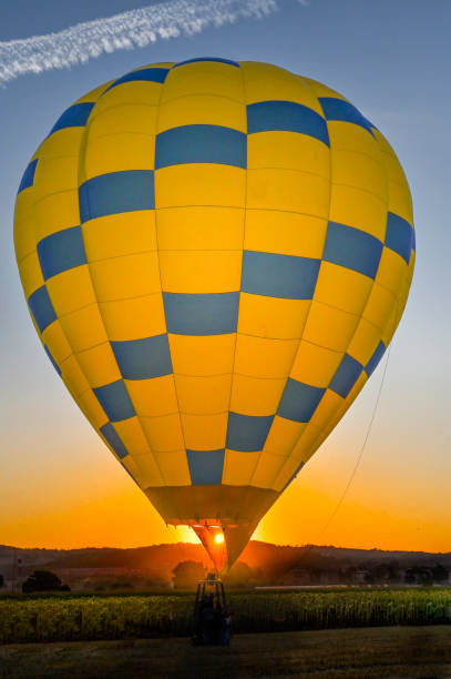 istock Sunrise with hot air balloon 1413403512