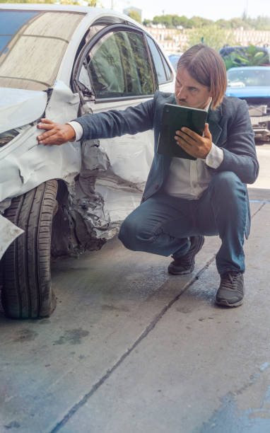 istock Inspecting Car Damage After A Traffic Accident 1413408187