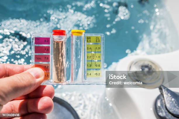 Hot Tub Water Quality Check By Using Chemical Testing Kit Stock Photo - Download Image Now