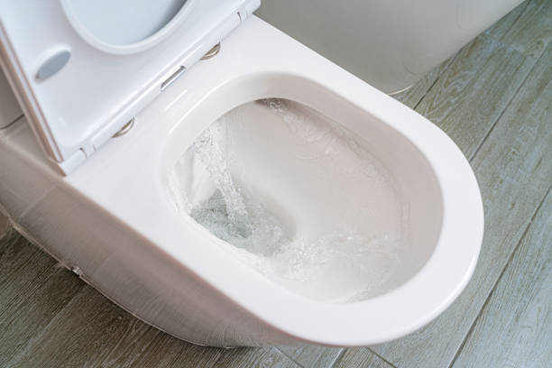 istock Toilet bowl with flushing water 1413409043