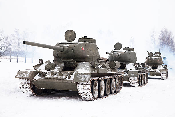 Russian Tanks T34 Row of Legendary Russian Tanks T34 in winter. former soviet union stock pictures, royalty-free photos & images