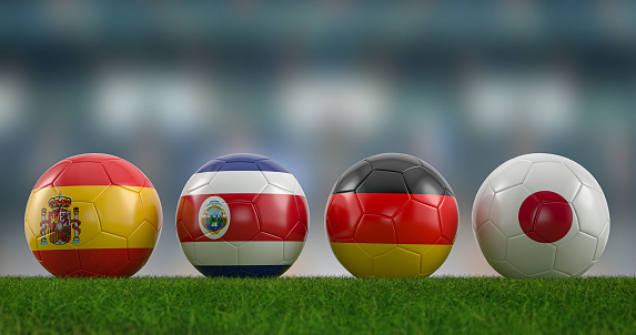 Football balls national flags group E on football pitch. 3d illustration.