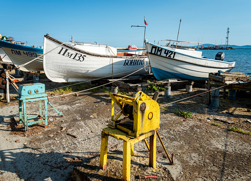 Pomorie, Bulgaria, May 10, 2022: Fishing boats at the shore in Pomorie. Bulgaria, Europe.