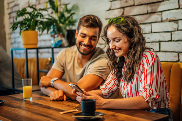 istock Couple looking at smartphone 1413411788