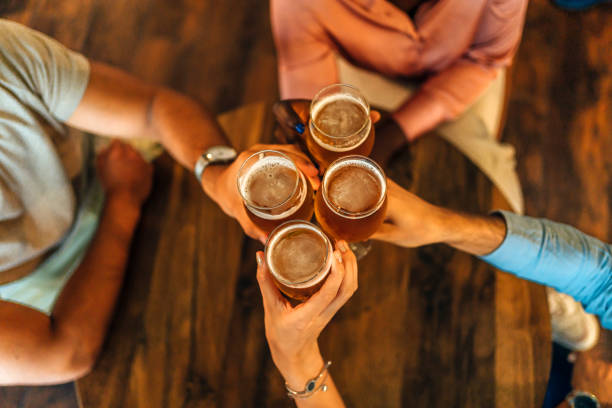 istock Friends making a toast in the bar 1413412372