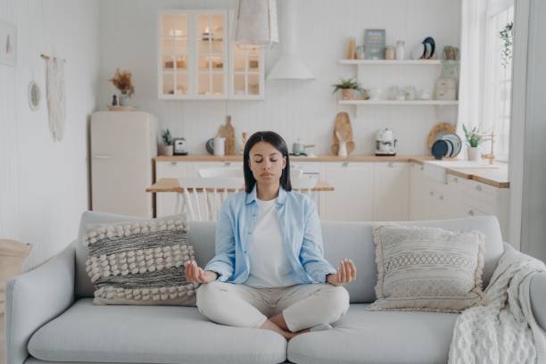 istock Peaceful mind, zen and concentration. Young hispanic woman is practicing yoga at home. 1413413556