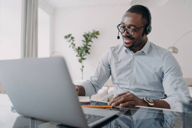 istock Manager of client support service has conversation. Afro american guy speaking in front of camera. 1413417617