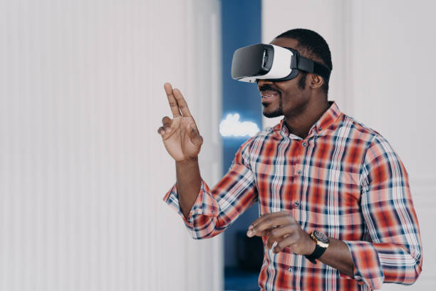 istock African american guy in virtual reality glasses test purchase in online store. Ecommerce, cyberspace 1413417670