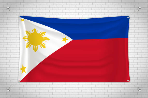 флаг филиппин висит на кирпичной стене. - philippines flag vector illustration and painting stock illustrations