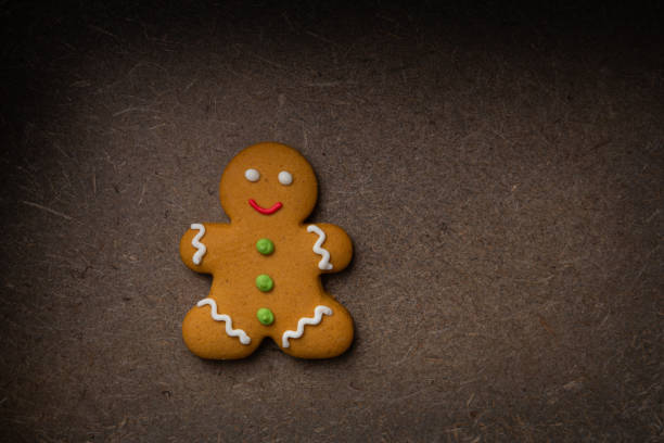 istock Top view of Christmas gingerbread man  cookies on dark surface 1413418963