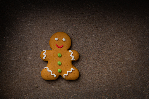Top view of Christmas gingerbread man  cookies on dark surface