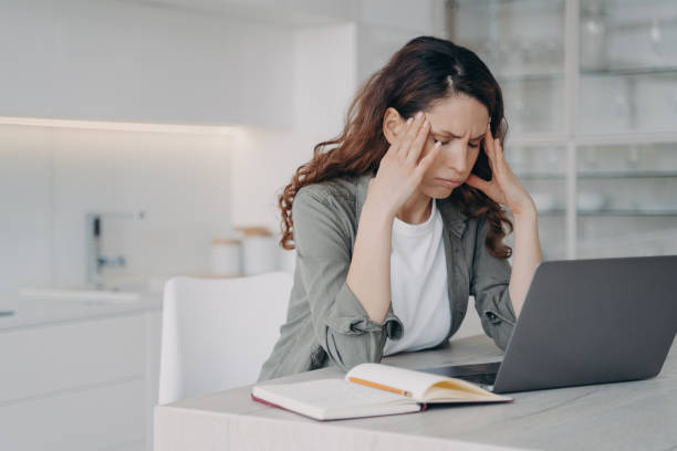 istock Remote education or work at home office. Spanish woman is exhausted from online conference. 1413419011