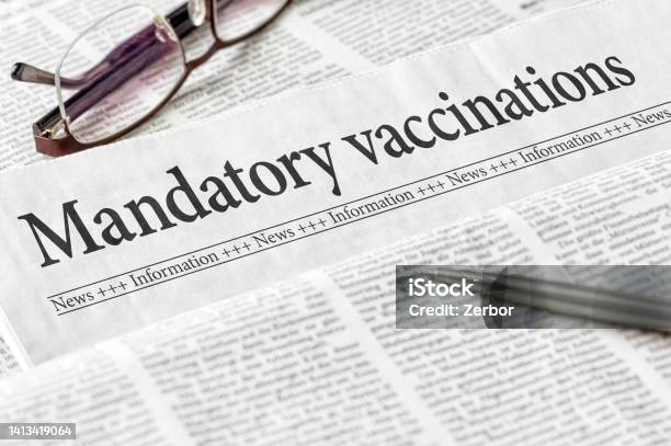A Newspaper With The Headline Mandatory Vaccination Stock Photo - Download Image Now