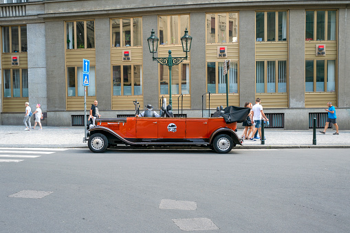 Prague - April 25, 2017: A retro car on the street in Prague. Cars are used for tourist excursions in Prague. Drivers waiting for the clients.