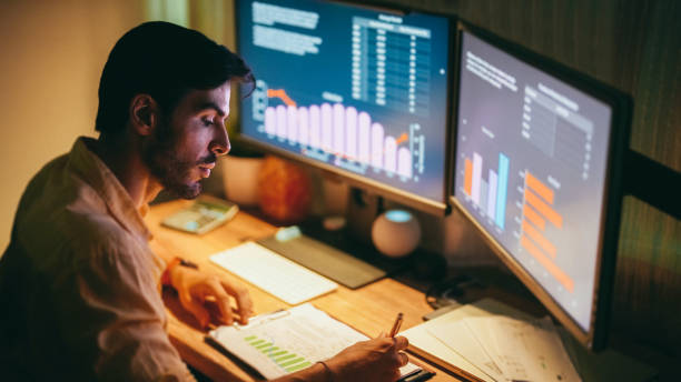 istock Businessman at home working late 1413419537