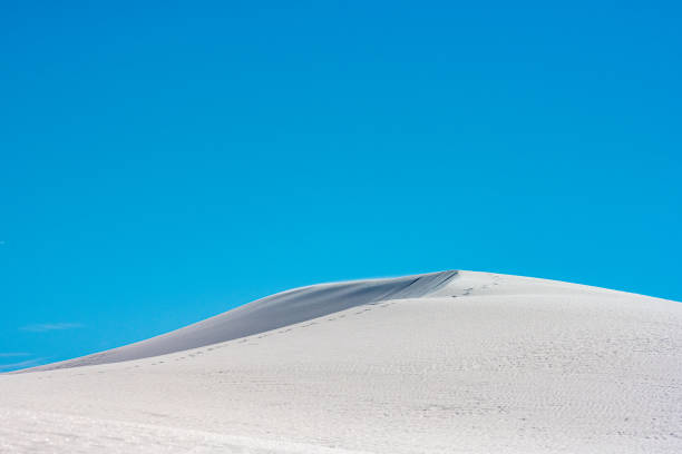 istock Sand Begins Saltation Off The Peark Of A Dune 1413420896