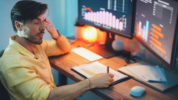 istock Businessman at home working late 1413420946
