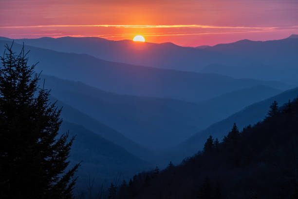 istock Sun Rising Over Layers of Mountains From Mill Overlook 1413423728