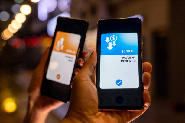 Transferring money via mobile banking app stock photo