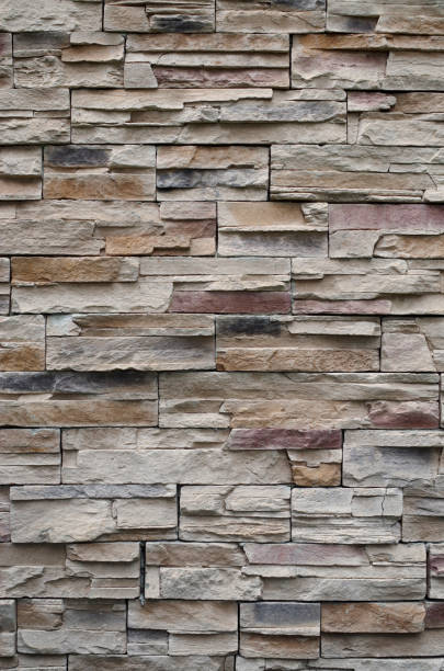 istock Colorful relief tiles imitating stone on wall close 1413428217