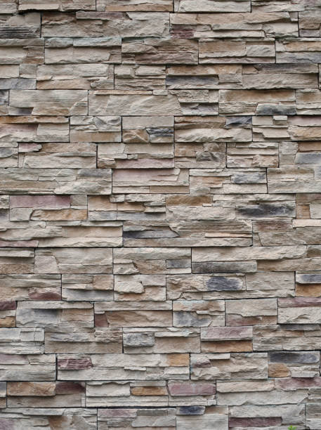 istock Colorful relief tiles imitating stone on wall close 1413428218