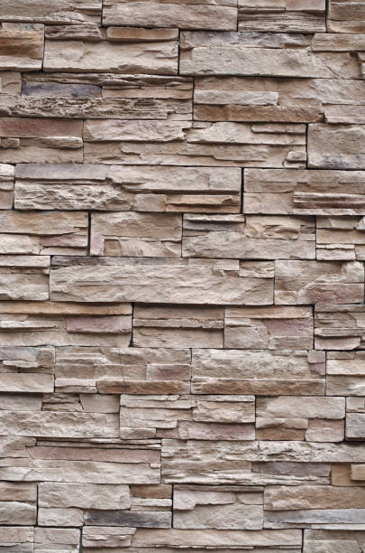 istock Colorful relief tiles imitating stone on wall close 1413428246