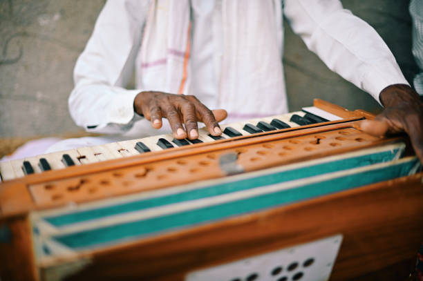 istock Cropped hands playing harmonium, a musical instrument 1413429120