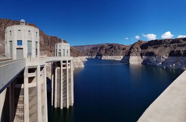 Hoover Dam - Lake Mead Hoover Dam is a concrete arch-gravity dam in the Black Canyon of the Colorado River, on the border between the U.S. states of Nevada and Arizona. It was constructed between 1931 and 1936 during the Great Depression and was dedicated on September 30, 1935, by President Franklin D. Roosevelt. Its construction was the result of a massive effort involving thousands of workers, and cost over one hundred lives. It was referred to as Hoover Dam after President Herbert Hoover in bills passed by Congress during its construction; it was named Boulder Dam by the Roosevelt administration. The Hoover Dam name was restored by Congress in 1947.
Lake Mead National Recreation Area is a U.S. national recreation area in southeastern Nevada and northwestern Arizona. Operated by the National Park Service, Lake Mead NRA follows the Colorado River corridor from the westernmost boundary of Grand Canyon National Park to just north of the cities of Laughlin, Nevada and Bullhead City, Arizona. It includes all of the eponymous Lake Mead as well as the smaller Lake Mohave – reservoirs on the river created by Hoover Dam and Davis Dam, respectively – and the surrounding desert terrain and wilderness. colorado river stock pictures, royalty-free photos & images