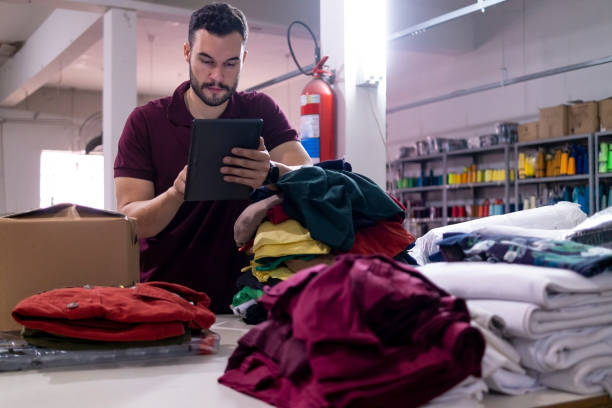 istock Young man in a clothes industry 1413432680