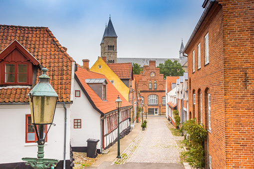Street with old houses leading to the Domkirke church in Viborg, Denmark