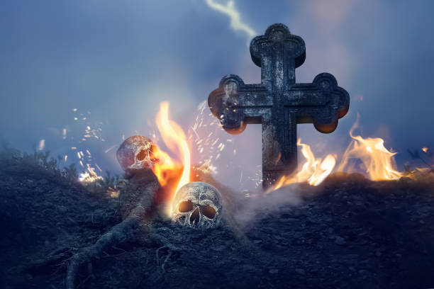 istock Cross and skull in the cemetery. Halloween image. 1413435766