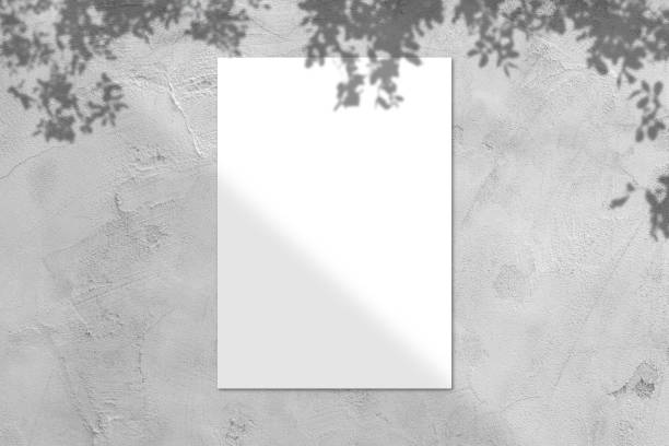 istock Blank white square poster mockup with light shadow on gray concrete wall background. 1413437151