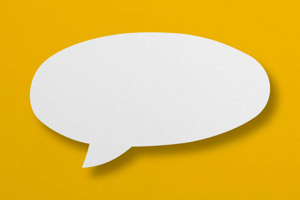 istock speech balloon shape white paper isolated on yellow background 1413437188