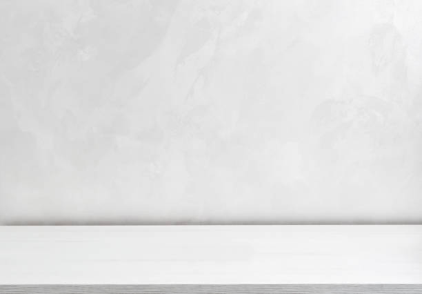 istock Blank white desk near wall. Template. Close up. 1413437388