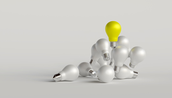 Distinctive yellow light bulb floats above the white light bulb. concept of talented leadership and outstanding ideas, selected good ideas, Innovation and inspiration. with copy 3D render illustration