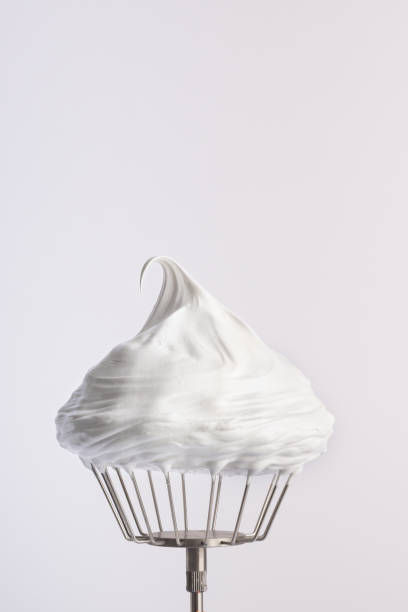 istock Merengue. Confectionery whipped cream on a whisk 1413438424