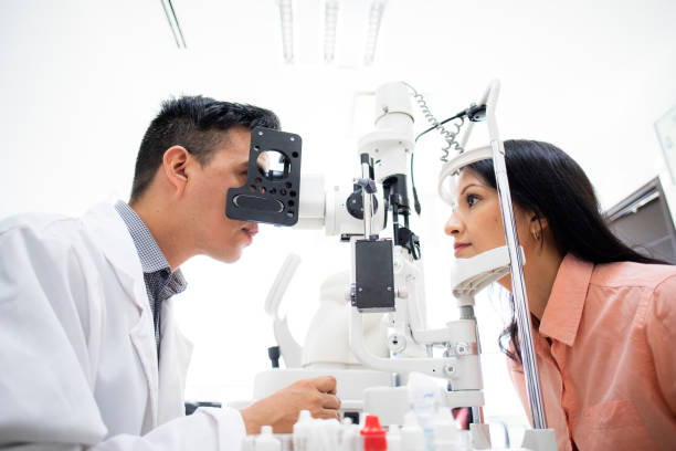 istock oculist examining female patient 1413439357