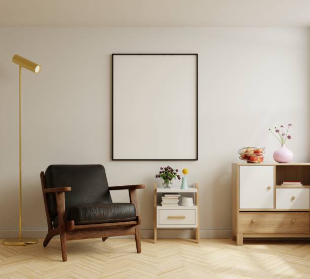 istock Mock up poster frame with leather armchair in modern interior background. 1413439433