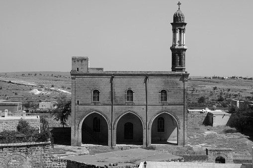 Black and white photo of one of the churches of the city of Midyat