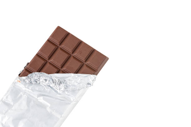 istock Milk chocolate bar in foil. isolated on white with clipping path 1413440837