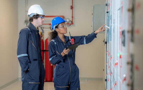 istock The factory engineer team inspects the electrical system in the control room. 1413442658