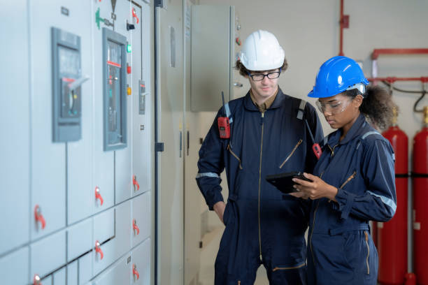 istock The factory engineer team inspects the electrical system in the control room. 1413442661