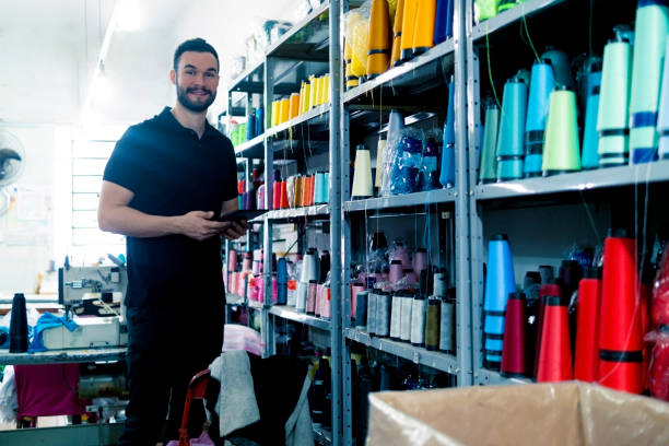 istock Young man in a clothes industry 1413443819