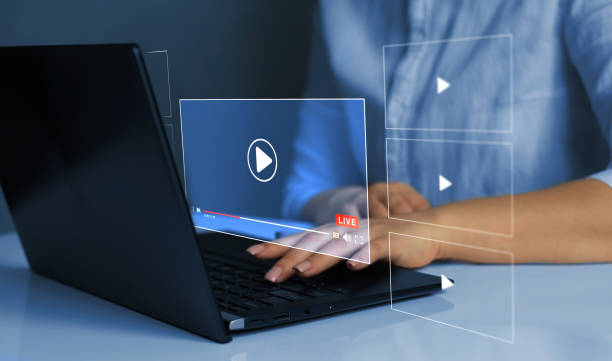 istock Business person watching a live stream.Online live stream window. Video streaming on internet concept.	 Live digital stream multimedia player. 1413444002