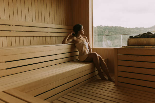 istock Young woman relaxing in the sauna 1413445906