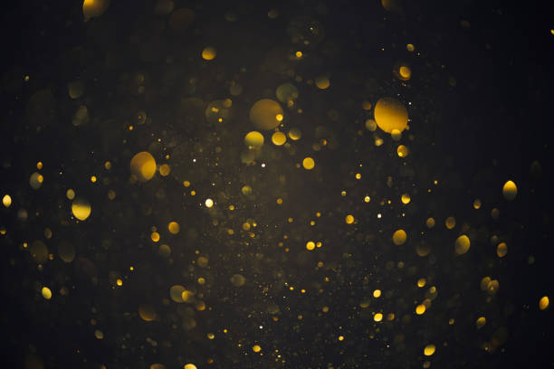 istock Gold glitter particles lights abstract background 1413447116