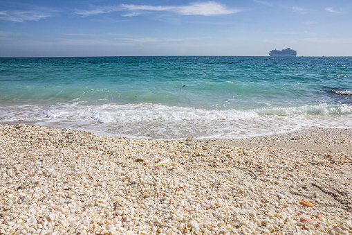 Sea pebble beach in Abu Dhabi, UAE. Sir Bani Yas island