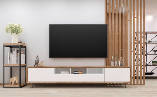 modernes wohnzimmer mit einem fernseher auf einem schrank und getäfelter wandtrennwand - home decorating showcase interior living room home interior stock-fotos und bilder