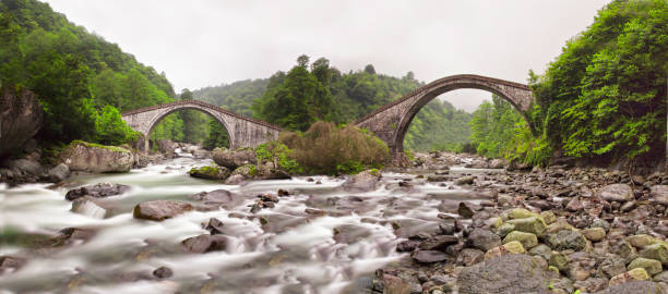 istock Double Bridge in Artvin. It is the famous two adjacent arch bridge in Arhavi district. It is the most popular touristic stop of Artvin. Turkey 1413452740